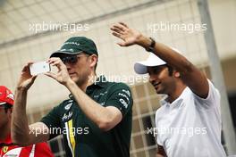 (L to R): Vitaly Petrov (RUS) Caterham and Narain Karthikeyan (IND) Hispania Racing F1 Team (HRT) on the drivers parade. Motor Racing - Formula One World Championship - Bahrain Grand Prix - Race Day - Sakhir, Bahrain