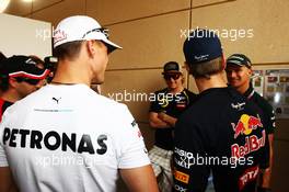(L to R): Michael Schumacher (GER) Mercedes AMG F1; Kimi Raikkonen (FIN) Lotus F1 Team; Sebastian Vettel (GER) Red Bull Racing and Heikki Kovalainen (FIN) Caterham on the drivers parade. Motor Racing - Formula One World Championship - Bahrain Grand Prix - Race Day - Sakhir, Bahrain