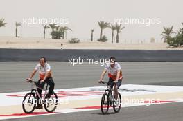 Paul di Resta (GBR) Sahara Force India F1 cycles the circuit with Gianpiero Lambiase (ITA) Sahara Force India F1 Engineer. 19.04.2012. Formula 1 World Championship, Rd 4, Bahrain Grand Prix, Sakhir, Bahrain, Preparation Day