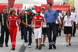 Felipe Massa (BRA) Ferrari with Matteo Bonciani (ITA) FIA Media Delegate. 19.04.2012. Formula 1 World Championship, Rd 4, Bahrain Grand Prix, Sakhir, Bahrain, Preparation Day