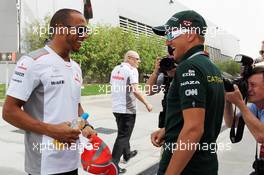 (L to R): Lewis Hamilton (GBR) McLaren with Heikki Kovalainen (FIN) Caterham. 19.04.2012. Formula 1 World Championship, Rd 4, Bahrain Grand Prix, Sakhir, Bahrain, Preparation Day