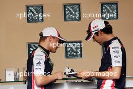 (L to R): Valtteri Bottas (FIN) Williams Third Driver with Bruno Senna (BRA) Williams. 19.04.2012. Formula 1 World Championship, Rd 4, Bahrain Grand Prix, Sakhir, Bahrain, Preparation Day