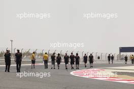 The Lotus F1 Team walk the circuit. 19.04.2012. Formula 1 World Championship, Rd 4, Bahrain Grand Prix, Sakhir, Bahrain, Preparation Day
