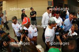 (L to R): Lewis Hamilton (GBR) McLaren and Nico Rosberg (GER) Mercedes AMG F1 with the media. 19.04.2012. Formula 1 World Championship, Rd 4, Bahrain Grand Prix, Sakhir, Bahrain, Preparation Day