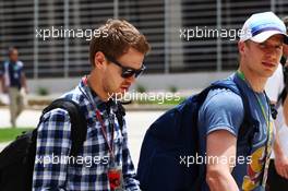 Sebastian Vettel (GER) Red Bull Racing with Heikki Huovinen (FIN) Personal Trainer. 19.04.2012. Formula 1 World Championship, Rd 4, Bahrain Grand Prix, Sakhir, Bahrain, Preparation Day