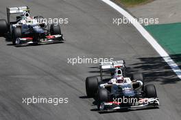 Kamui Kobayashi (JPN) Sauber C31 leads team mate Sergio Perez (MEX) Sauber C31. 23.11.2012. Formula 1 World Championship, Rd 20, Brazilian Grand Prix, Sao Paulo, Brazil, Practice Day.