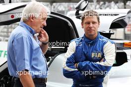 (L to R): Charlie Whiting (GBR) FIA Delegate with Bernd Maylander (GER) FIA Safety Car Driver on the grid. 25.11.2012. Formula 1 World Championship, Rd 20, Brazilian Grand Prix, Sao Paulo, Brazil, Race Day.