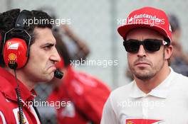 (L to R): Andrea Stella (ITA) Ferrari Race Engineer with Fernando Alonso (ESP) Ferrari on the grid. 25.11.2012. Formula 1 World Championship, Rd 20, Brazilian Grand Prix, Sao Paulo, Brazil, Race Day.