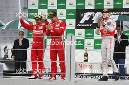 (L to R): Felipe Massa (BRA) Ferrari and Fernando Alonso (ESP) Ferrari celebrate on the podium with race winner Jenson Button (GBR) McLaren. 25.11.2012. Formula 1 World Championship, Rd 20, Brazilian Grand Prix, Sao Paulo, Brazil, Race Day.