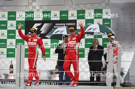 (L to R): Felipe Massa (BRA) Ferrari and Fernando Alonso (ESP) Ferrari celebrate on the podium. 25.11.2012. Formula 1 World Championship, Rd 20, Brazilian Grand Prix, Sao Paulo, Brazil, Race Day.