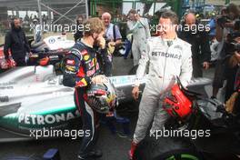Sebastian Vettel (GER), Red Bull Racing and Michael Schumacher (GER), Mercedes GP  25.11.2012. Formula 1 World Championship, Rd 20, Brazilian Grand Prix, Sao Paulo, BRA, Race Day