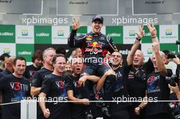 Sebastian Vettel (GER) Red Bull Racing celebrates winning the World Championship with the team. 25.11.2012. Formula 1 World Championship, Rd 20, Brazilian Grand Prix, Sao Paulo, Brazil, Race Day.