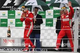 (L to R): Felipe Massa (BRA) Ferrari and Fernando Alonso (ESP) Ferrari celebrate on the podium. 25.11.2012. Formula 1 World Championship, Rd 20, Brazilian Grand Prix, Sao Paulo, Brazil, Race Day.