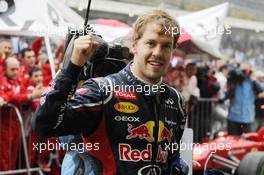 Sebastian Vettel (GER) Red Bull Racing celebrates his World Championship in parc ferme. 25.11.2012. Formula 1 World Championship, Rd 20, Brazilian Grand Prix, Sao Paulo, Brazil, Race Day.