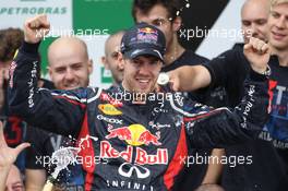 Sebastian Vettel (GER), Red Bull Racing celebrates with the team  25.11.2012. Formula 1 World Championship, Rd 20, Brazilian Grand Prix, Sao Paulo, BRA, Race Day