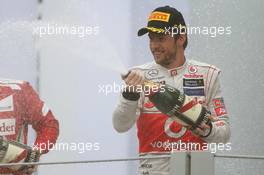 Race winner Jenson Button (GBR) McLaren celebrates on the podium. 25.11.2012. Formula 1 World Championship, Rd 20, Brazilian Grand Prix, Sao Paulo, Brazil, Race Day.