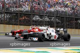 Kamui Kobayashi (JPN) Sauber C31 and Fernando Alonso (ESP) Ferrari F2012. 25.11.2012. Formula 1 World Championship, Rd 20, Brazilian Grand Prix, Sao Paulo, Brazil, Race Day.