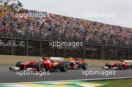 Fernando Alonso (ESP) Ferrari F2012 leads Mark Webber (AUS) Red Bull Racing RB8 and Felipe Massa (BRA) Ferrari F2012. 25.11.2012. Formula 1 World Championship, Rd 20, Brazilian Grand Prix, Sao Paulo, Brazil, Race Day.