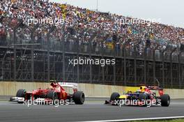 Felipe Massa (BRA) Ferrari F2012 and Sebastian Vettel (GER) Red Bull Racing RB8. 25.11.2012. Formula 1 World Championship, Rd 20, Brazilian Grand Prix, Sao Paulo, Brazil, Race Day.