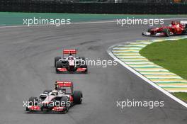 Lewis Hamilton (GBR) McLaren MP4/27 leads Jenson Button (GBR) McLaren MP4/27. 25.11.2012. Formula 1 World Championship, Rd 20, Brazilian Grand Prix, Sao Paulo, Brazil, Race Day.