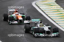 Nico Rosberg (GER) Mercedes AMG F1 W03 leads Paul di Resta (GBR) Sahara Force India VJM05. 25.11.2012. Formula 1 World Championship, Rd 20, Brazilian Grand Prix, Sao Paulo, Brazil, Race Day.