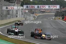 Michael Schumacher (GER), Mercedes GP and Mark Webber (AUS), Red Bull Racing  25.11.2012. Formula 1 World Championship, Rd 20, Brazilian Grand Prix, Sao Paulo, BRA, Race Day