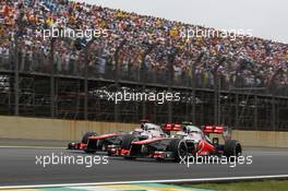 Lewis Hamilton (GBR) McLaren MP4/27 and team mate Jenson Button (GBR) McLaren MP4/27. 25.11.2012. Formula 1 World Championship, Rd 20, Brazilian Grand Prix, Sao Paulo, Brazil, Race Day.
