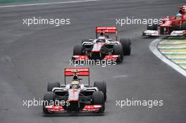Lewis Hamilton (GBR) McLaren MP4/27 leads Jenson Button (GBR) McLaren MP4/27. 25.11.2012. Formula 1 World Championship, Rd 20, Brazilian Grand Prix, Sao Paulo, Brazil, Race Day.