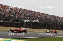 Fernando Alonso (ESP) Ferrari F2012 leads Mark Webber (AUS) Red Bull Racing RB8. 25.11.2012. Formula 1 World Championship, Rd 20, Brazilian Grand Prix, Sao Paulo, Brazil, Race Day.