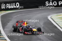 Sebastian Vettel (GER) Red Bull Racing RB8 exits the pits. 25.11.2012. Formula 1 World Championship, Rd 20, Brazilian Grand Prix, Sao Paulo, Brazil, Race Day.