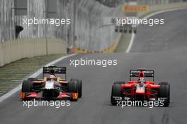 Narain Karthikeyan (IND), HRT Formula One Team and Timo Glock (GER), Marussia F1 Team  25.11.2012. Formula 1 World Championship, Rd 20, Brazilian Grand Prix, Sao Paulo, BRA, Race Day