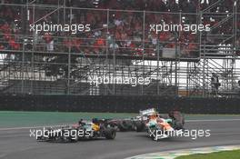 Nico Hulkenberg (GER) Sahara Force India F1 VJM05 and Lewis Hamilton (GBR) McLaren MP4/27 crash battling for the lead of the race. 25.11.2012. Formula 1 World Championship, Rd 20, Brazilian Grand Prix, Sao Paulo, Brazil, Race Day.