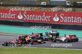 Sebastian Vettel (GER) Red Bull Racing RB8 spins at the start of the race. 25.11.2012. Formula 1 World Championship, Rd 20, Brazilian Grand Prix, Sao Paulo, Brazil, Race Day.