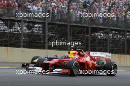 Felipe Massa (BRA) Ferrari F2012 and Mark Webber (AUS) Red Bull Racing RB8. 25.11.2012. Formula 1 World Championship, Rd 20, Brazilian Grand Prix, Sao Paulo, Brazil, Race Day.