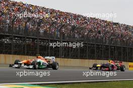 Nico Hulkenberg (GER) Sahara Force India F1 VJM05 leads Mark Webber (AUS) Red Bull Racing RB8. 25.11.2012. Formula 1 World Championship, Rd 20, Brazilian Grand Prix, Sao Paulo, Brazil, Race Day.