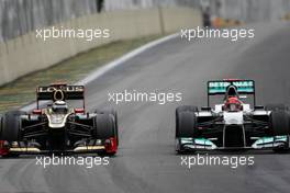 Kimi Raikkonen (FIN), Lotus F1 Team and Michael Schumacher (GER), Mercedes GP  25.11.2012. Formula 1 World Championship, Rd 20, Brazilian Grand Prix, Sao Paulo, BRA, Race Day