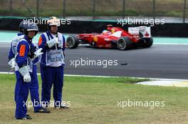 Fernando Alonso (ESP) Ferrari F2012 passes marshalls. 25.11.2012. Formula 1 World Championship, Rd 20, Brazilian Grand Prix, Sao Paulo, Brazil, Race Day.