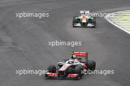 Lewis Hamilton (GBR) McLaren MP4/27 leads Nico Hulkenberg (GER) Sahara Force India F1 VJM05. 25.11.2012. Formula 1 World Championship, Rd 20, Brazilian Grand Prix, Sao Paulo, Brazil, Race Day.