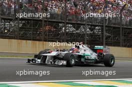 Michael Schumacher (GER) Mercedes AMG F1 W03 and Daniel Ricciardo (AUS) Scuderia Toro Rosso STR7. 25.11.2012. Formula 1 World Championship, Rd 20, Brazilian Grand Prix, Sao Paulo, Brazil, Race Day.