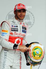 Lewis Hamilton (GBR) McLaren celebrates his pole position in parc ferme. 24.11.2012. Formula 1 World Championship, Rd 20, Brazilian Grand Prix, Sao Paulo, Brazil, Qualifying Day.