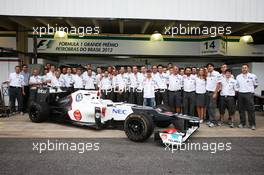 Kamui Kobayashi (JPN) Sauber C31 in a team photo. 24.11.2012. Formula 1 World Championship, Rd 20, Brazilian Grand Prix, Sao Paulo, Brazil, Qualifying Day.