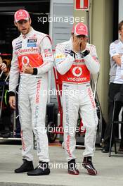 (L to R): Jenson Button (GBR) McLaren and Lewis Hamilton (GBR) McLaren at a team photograph. 25.11.2012. Formula 1 World Championship, Rd 20, Brazilian Grand Prix, Sao Paulo, Brazil, Race Day.