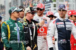 (L to R): Heikki Kovalainen (FIN) Caterham; Kimi Raikkonen (FIN) Lotus F1 Team; Jenson Button (GBR) McLaren; Pastor Maldonado (VEN) Williams on the drivers parade. 25.11.2012. Formula 1 World Championship, Rd 20, Brazilian Grand Prix, Sao Paulo, Brazil, Race Day.
