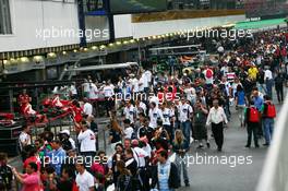 Fans in the pit lane. 25.11.2012. Formula 1 World Championship, Rd 20, Brazilian Grand Prix, Sao Paulo, Brazil, Race Day.