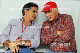 (L to R): Nelson Piquet (BRA) with Niki Lauda (AUT) Mercedes Non-Executive Chairman. 25.11.2012. Formula 1 World Championship, Rd 20, Brazilian Grand Prix, Sao Paulo, Brazil, Race Day.