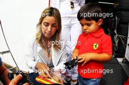 Rafaela Bassi (BRA), wife of Felipe Massa (BRA) Ferrari, and son Felipinho. 25.11.2012. Formula 1 World Championship, Rd 20, Brazilian Grand Prix, Sao Paulo, Brazil, Race Day.