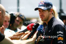 Sebastian Vettel (GER) Red Bull Racing with the media. 22.11.2012. Formula 1 World Championship, Rd 20, Brazilian Grand Prix, Sao Paulo, Brazil, Preparation Day.