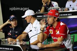 (L to R): Sebastian Vettel (GER) Red Bull Racing and Michael Schumacher (GER) Mercedes AMG F1 with Fernando Alonso (ESP) Ferrari in the FIA Press Conference. 22.11.2012. Formula 1 World Championship, Rd 20, Brazilian Grand Prix, Sao Paulo, Brazil, Preparation Day.