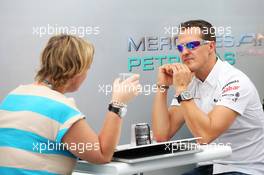 Michael Schumacher (GER) Mercedes AMG F1 with his manager Sabine Kehm (GER) (Left). 22.11.2012. Formula 1 World Championship, Rd 20, Brazilian Grand Prix, Sao Paulo, Brazil, Preparation Day.