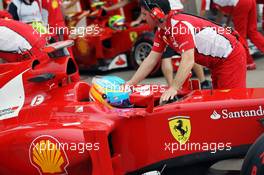 Fernando Alonso (ESP) Ferrari F2012 and team mate Felipe Massa (BRA) Ferrari F2012 in the pits. 08.06.2012. Formula 1 World Championship, Rd 7, Canadian Grand Prix, Montreal, Canada, Practice Day